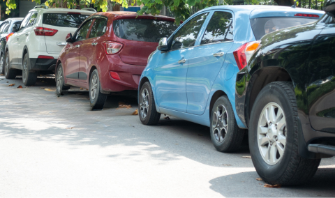 Cars parked on a street.