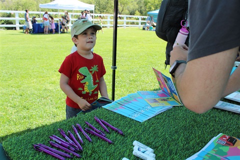 Picture of child at Junior Ranger Day event doing activities