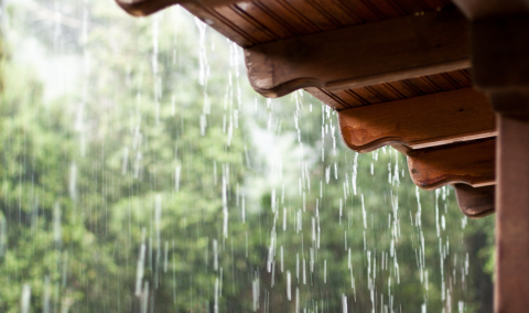 Rain falling off a roof.