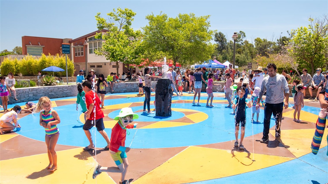 Children playing in splash pad.